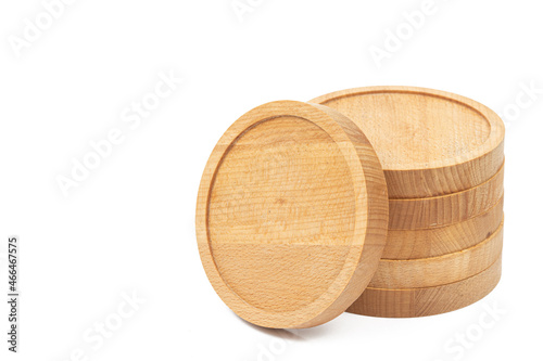 Round wooden coasters isolated above white background