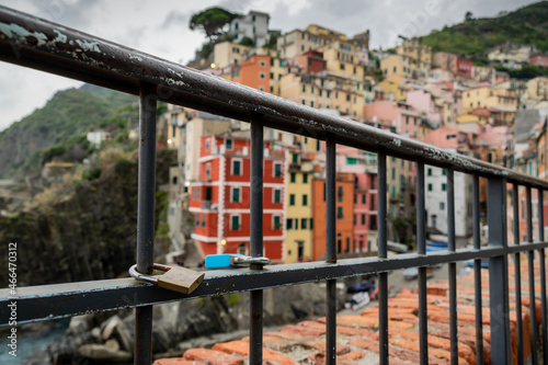 Locks attached to metal frame in touristic village of Riomaggiore