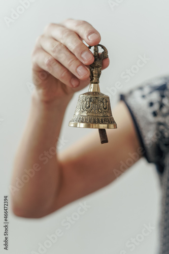 hand holding a bell