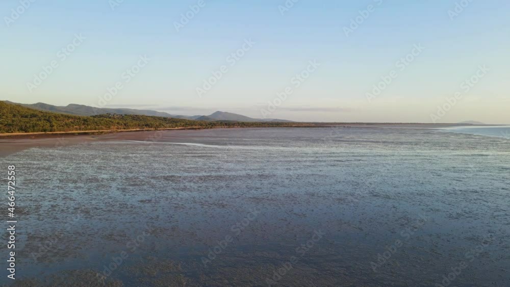 Drone Flyby Over Mudflats By The Coast Of Isaac Region During Low Tide. Clairview Town In Queensland, Australia On An Early Morning. wide Drone Flyby Over Mudflats By The Coast Of Isaac Region During Low Tide. Clairview Town In Queensland, Australia On An Early Morning. wide