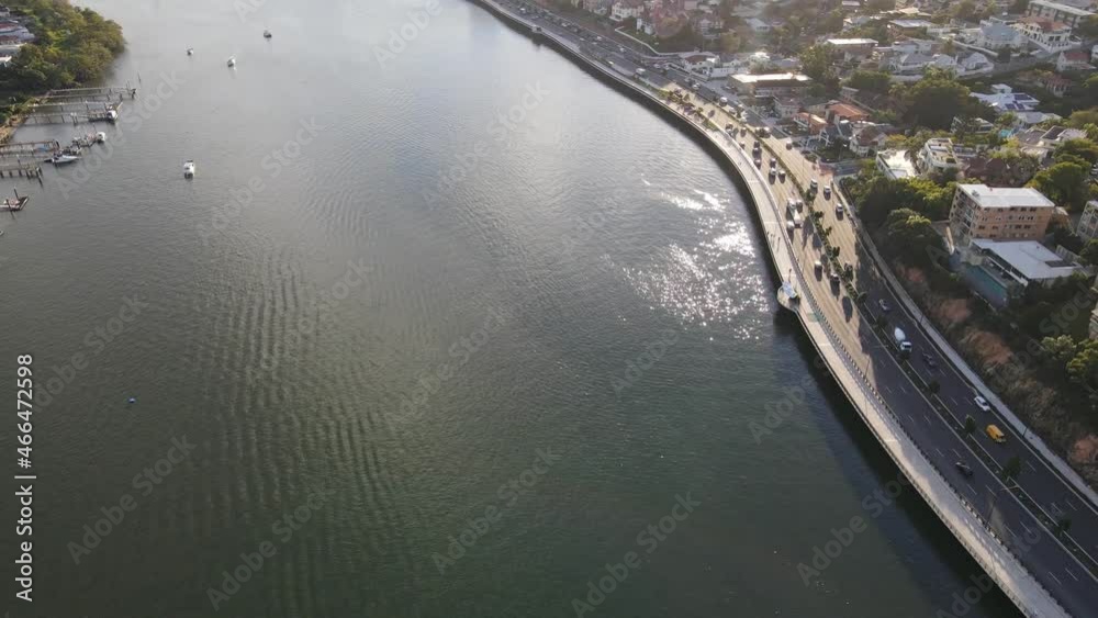 Vehicles Driving At The Kingsford Smith Drive Along The Brisbane River In QLD, Australia. aerial Vehicles Driving At The Kingsford Smith Drive Along The Brisbane River In QLD, Australia. aerial