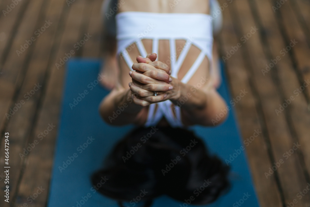 girl doing balance yoga pose on the mat, balance, fitness, stretching and relaxation	