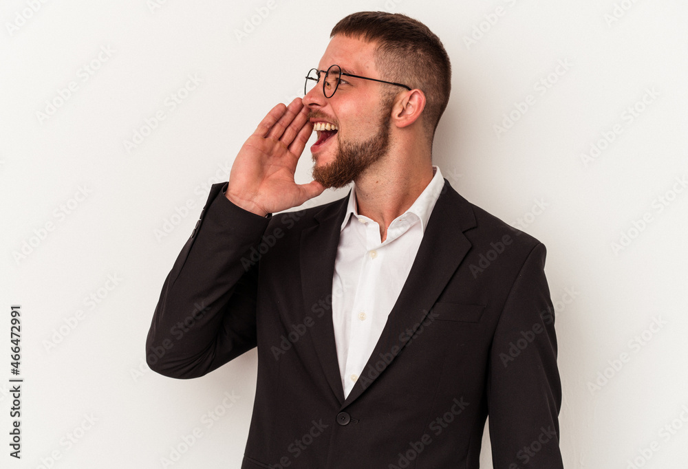 Young business caucasian man isolated on white background shouting and holding palm near opened mouth. Young business caucasian man isolated on white background shouting and holding palm near opened mouth.