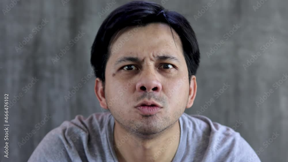 Angry man, Asian man is expressing his fury. Angry man, Asian man is expressing his fury.