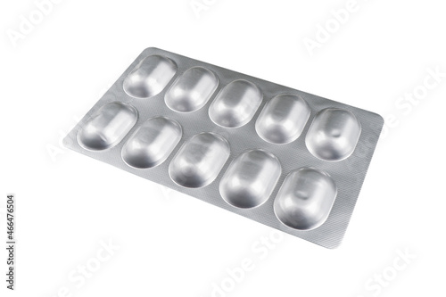 Obraz na plátně Macro shot pile of tablets in silver blister packaging isolated on white background