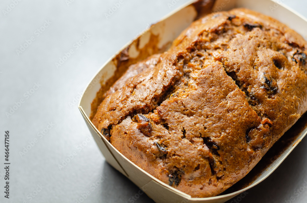 Freshly made spiced fruit loaf cake on the wooden background Freshly made spiced fruit loaf cake on the wooden background