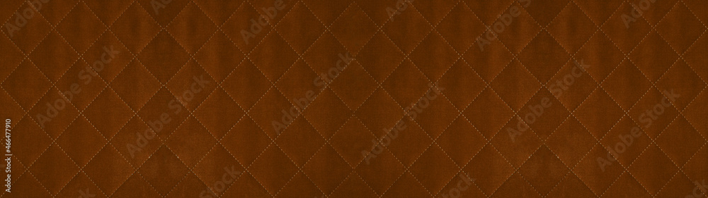 Fototapeta premium Brown caramel colored seamless natural cotton linen textile fabric texture pattern, with diamond quilted, rhombic stiching. stitched background banner panorama
