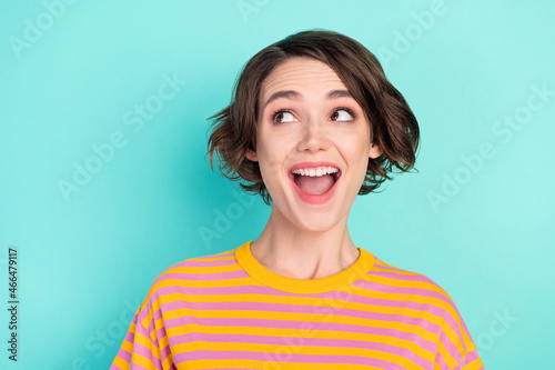 Portrait of attractive cheerful girlish brown-haired girl great news copy space isolated over bright teal turquoise color background