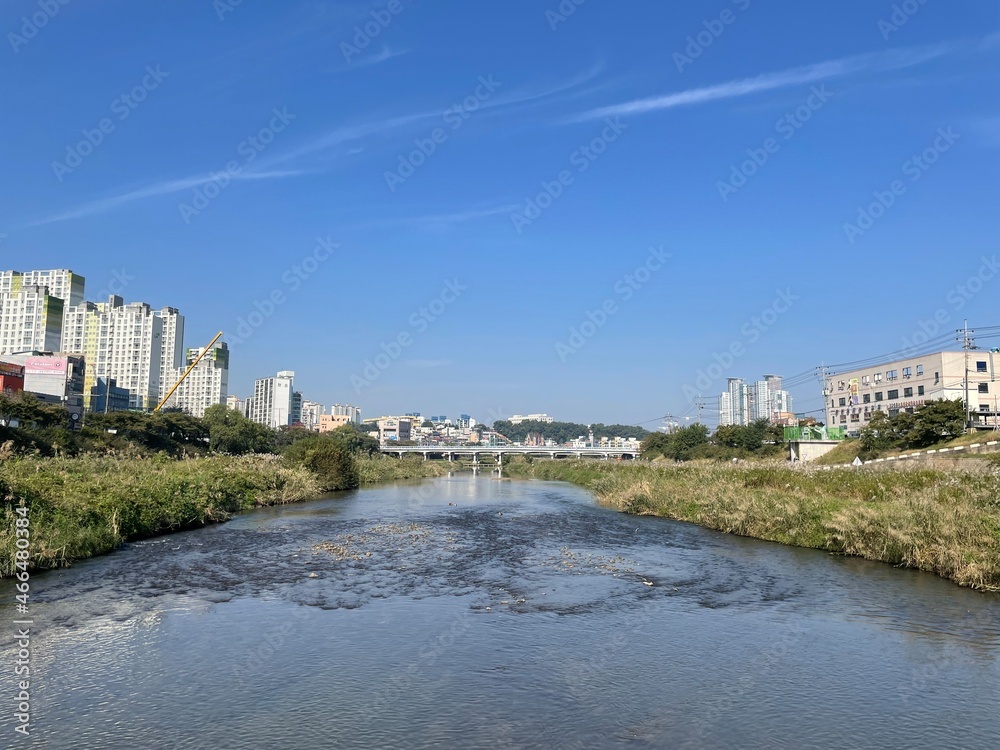 river and blue sky in the city