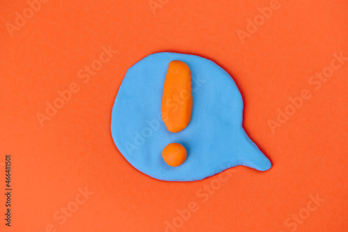 speech bubble with orange exclamation mark in the center