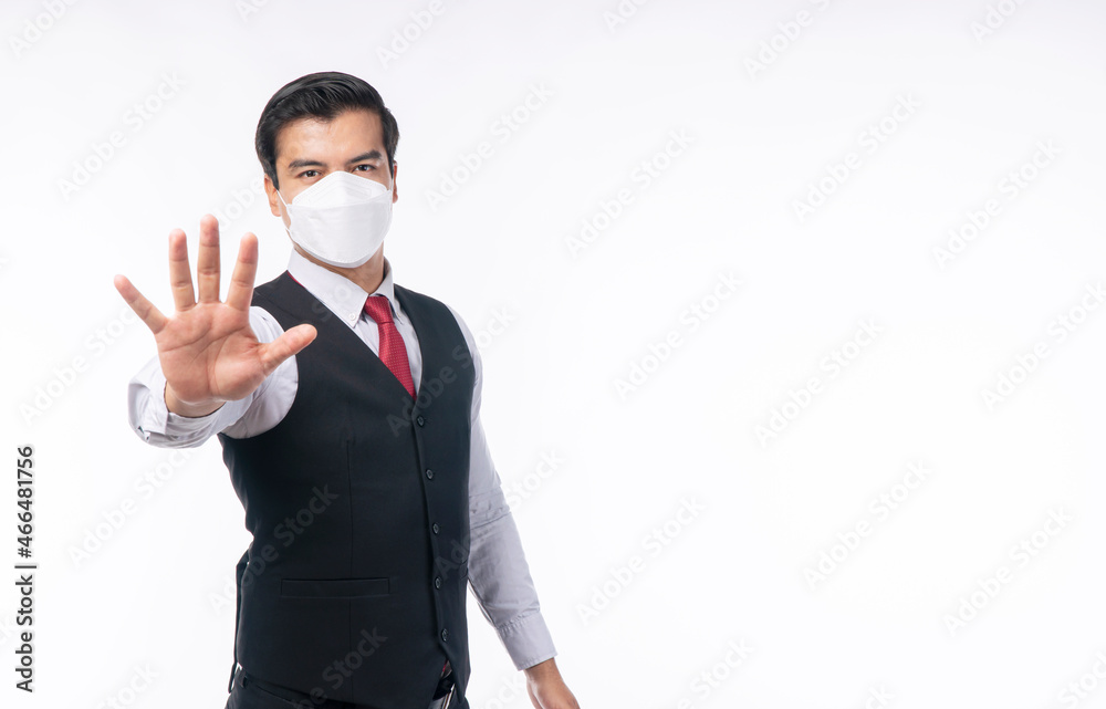 New normal protection flu diseases health care concept. Businessman wear medical protect face mask gesture holding stop own hands disease covid19 while standing over isolated white background. New normal protection flu diseases health care concept. Businessman wear medical protect face mask gesture holding stop own hands disease covid19 while standing over isolated white background.