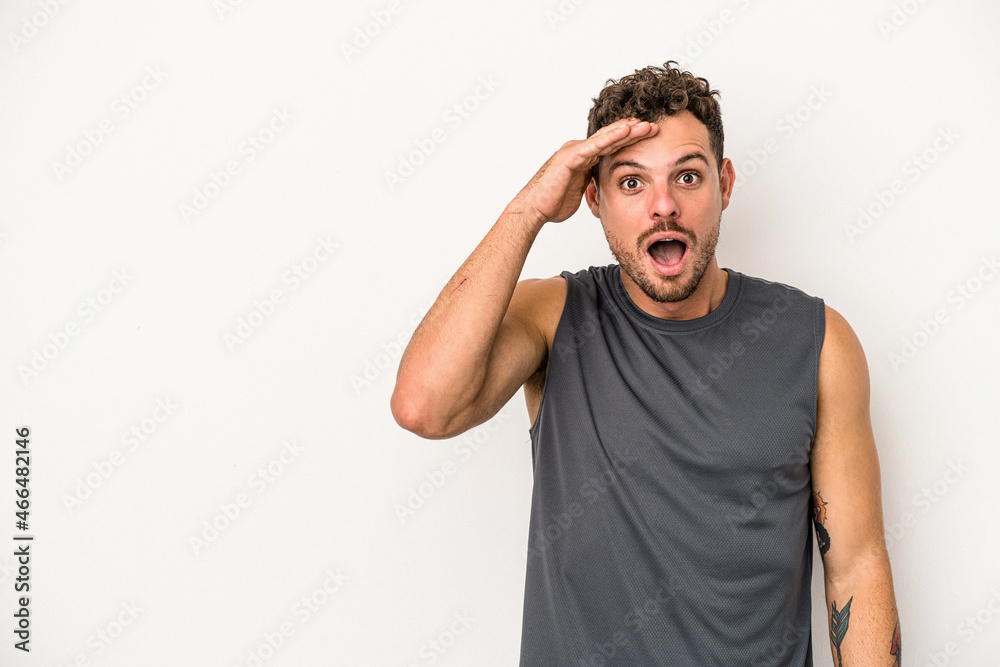 Young caucasian man isolated on white background shouts loud, keeps eyes opened and hands tense. Young caucasian man isolated on white background shouts loud, keeps eyes opened and hands tense.