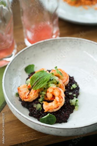 Black risotto with roasted shrimps 
