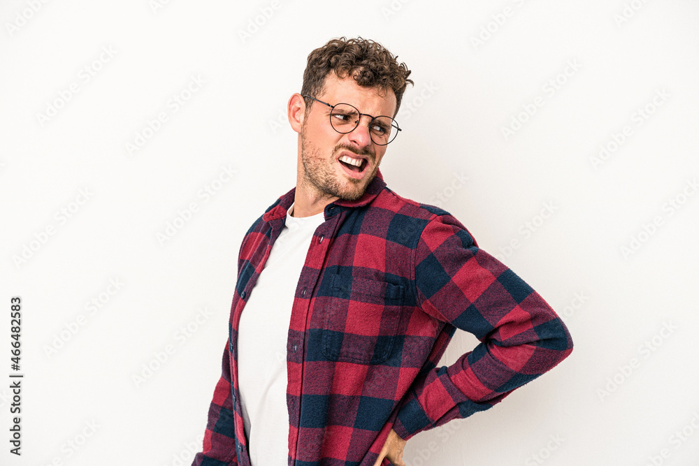 Young caucasian man isolated on white background suffering a back pain. Young caucasian man isolated on white background suffering a back pain.