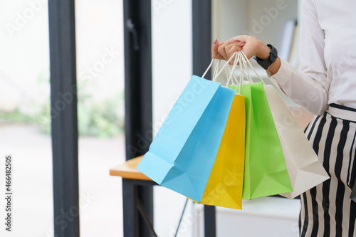 Women holding shopping bags in a shop