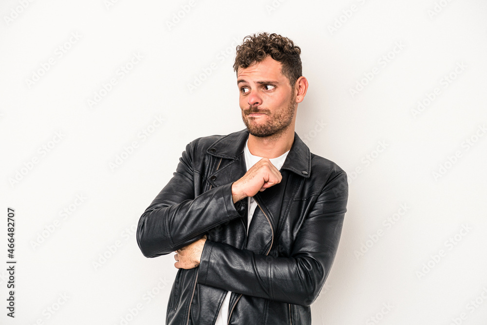 Young caucasian man isolated on white background confused, feels doubtful and unsure. Young caucasian man isolated on white background confused, feels doubtful and unsure.