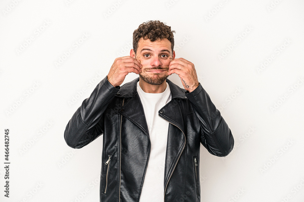 Young caucasian man isolated on white background doubting between two options. Young caucasian man isolated on white background doubting between two options.
