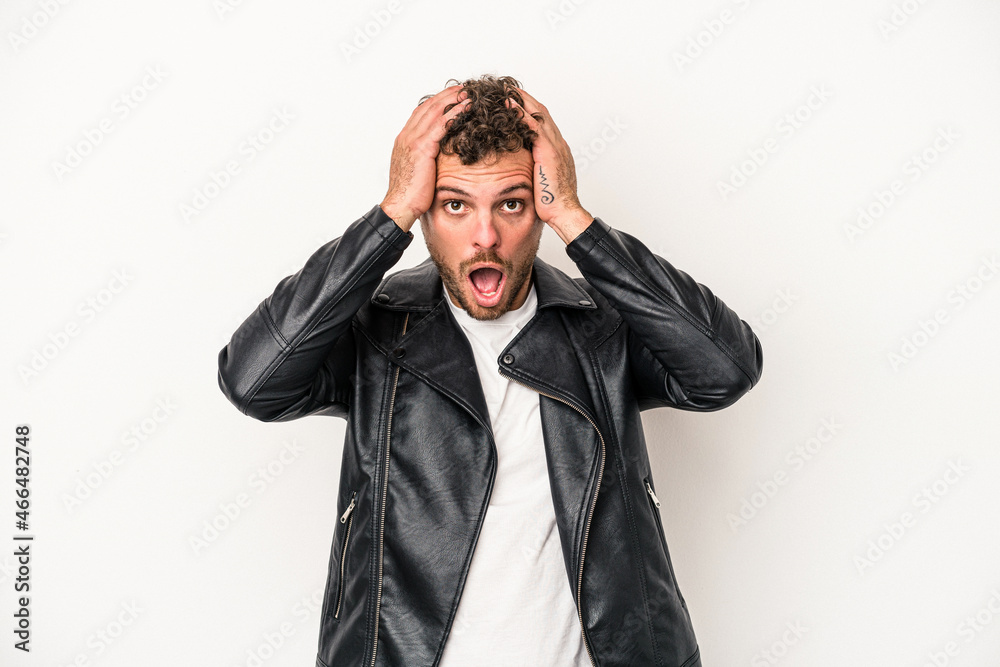 Young caucasian man isolated on white background surprised and shocked. Young caucasian man isolated on white background surprised and shocked.