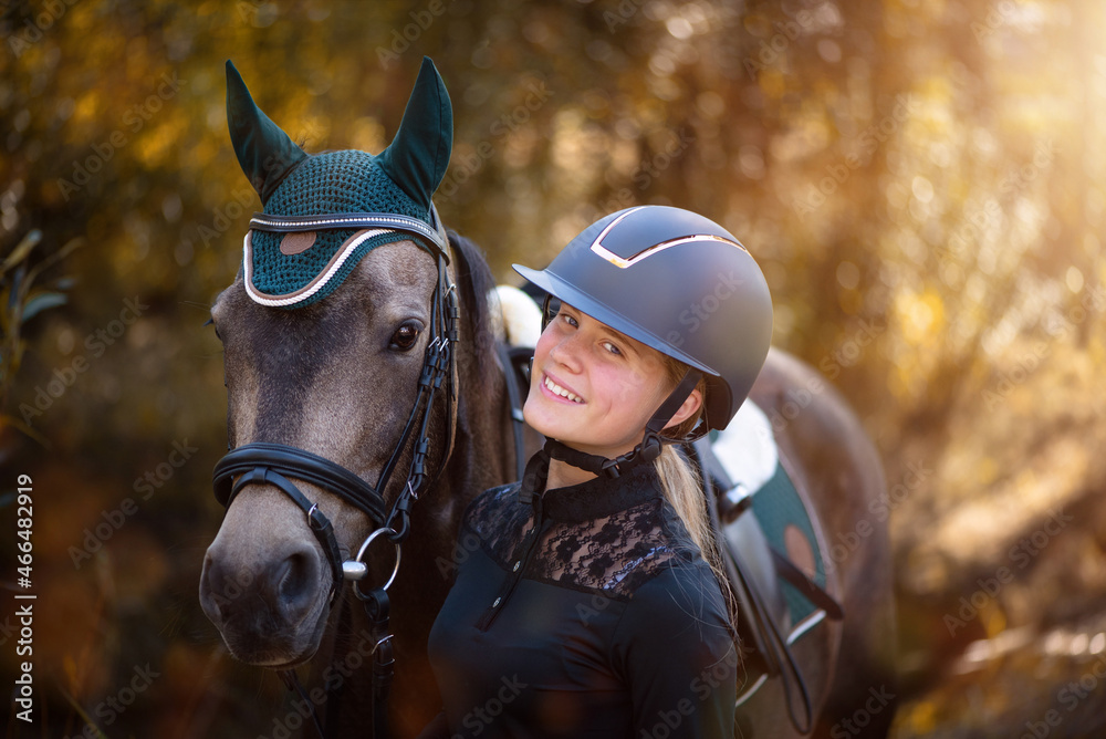 Obraz premium Mädchen mit Reitpony