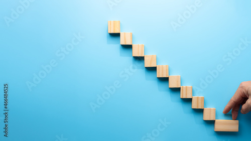 Concept design on wooden blocks on cyan background