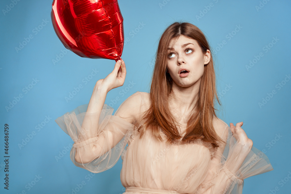 cheerful woman red heart in the hands of the balloon model studio cheerful woman red heart in the hands of the balloon model studio