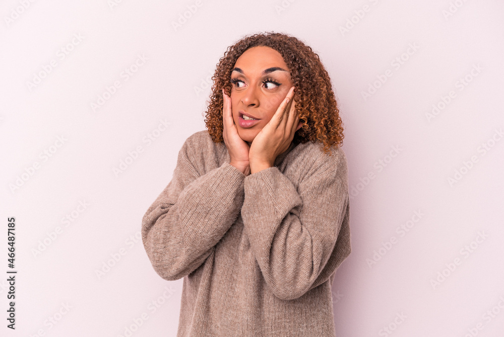 Young latin transsexual woman isolated on pink background scared and afraid. Young latin transsexual woman isolated on pink background scared and afraid.