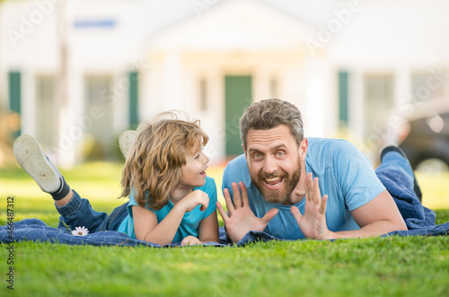 Wallpaper Mural amazed dad with child relax together on green park grass, relax Torontodigital.ca