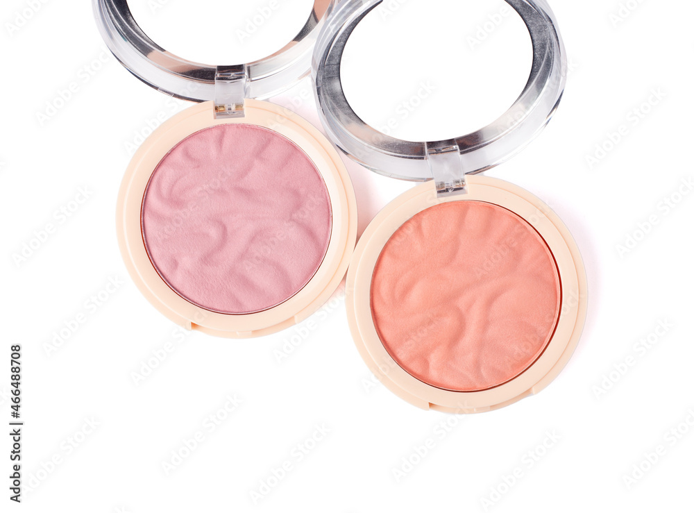Two nude pink and peach color eyeshadow isolated on white background. Highlighter and eyeshadows. Makeup product. Close up Two nude pink and peach color eyeshadow isolated on white background. Highlighter and eyeshadows. Makeup product. Close up