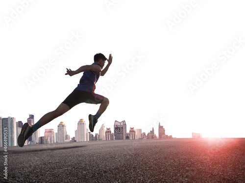 a man as athlete runner in high speed running action on the road