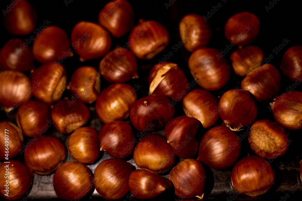 Chestnuts, maroni roasted chestnuts, popular autumn street food in Europe. Chestnuts, maroni roasted chestnuts, popular autumn street food in Europe.