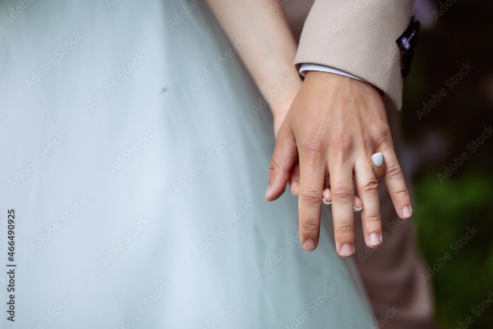 hands of bride and groom
