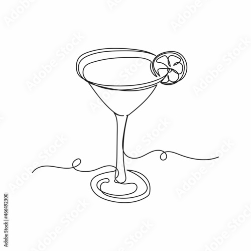 Vector continuous one single line drawing icon of martini cocktail with slice of lime in silhouette on a white background. Linear stylized.