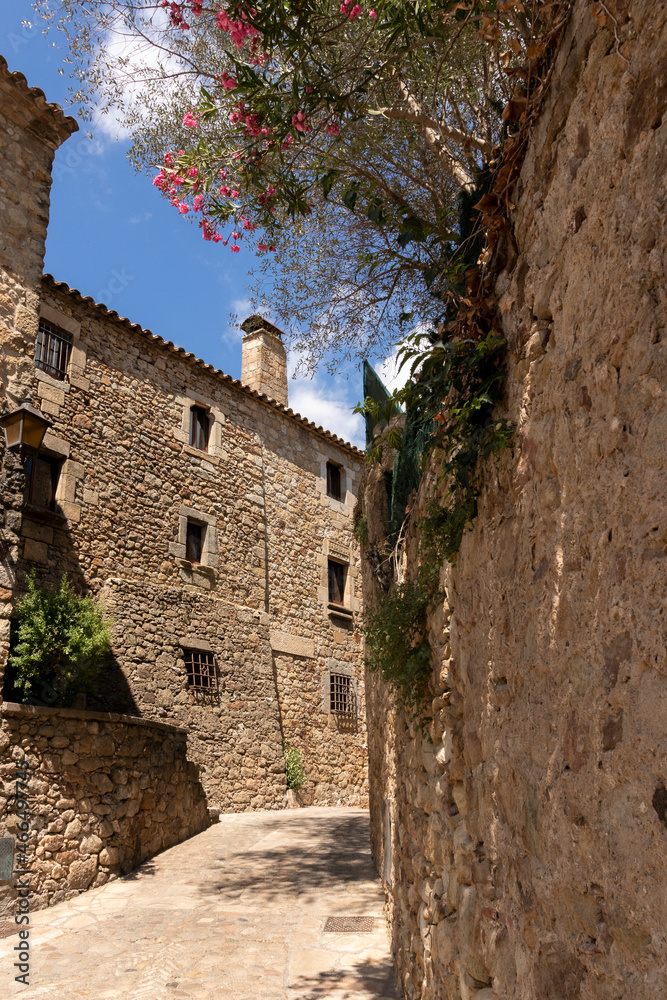 sunny alley on a summer day in a picturesque town on the Spanish costa brava