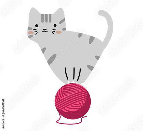 Cute  kitten with red ball of yarn