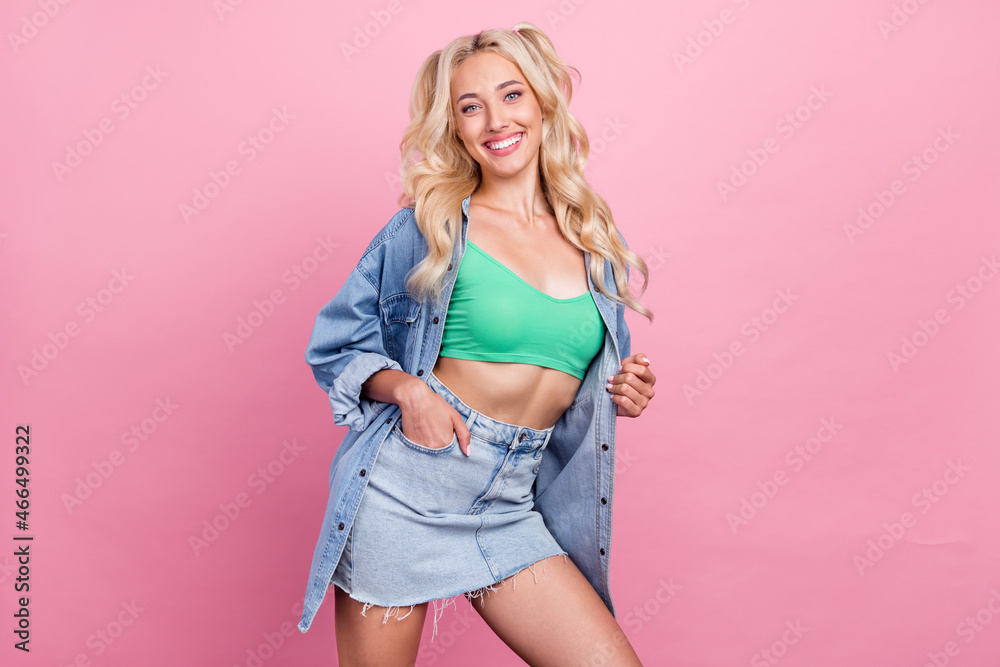 Photo of nice blond millennial lady wear jeans shirt skirt isolated on pink color background Photo of nice blond millennial lady wear jeans shirt skirt isolated on pink color background