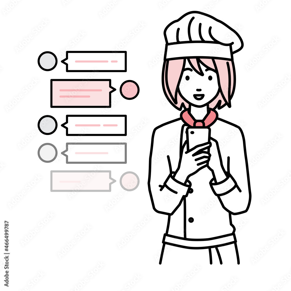 立ってスマートフォンで楽しくチャットで会話する調理師の女性 立ってスマートフォンで楽しくチャットで会話する調理師の女性