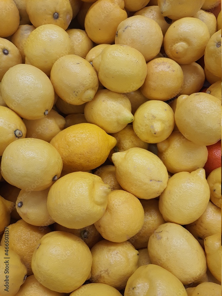 Fresh yellow lemon. full screen, top view, backgrounds and textures.