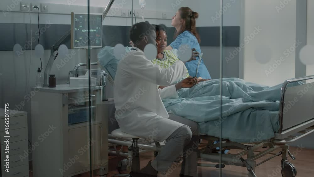 Man working as medic and explaining x ray scan results to patient with ...