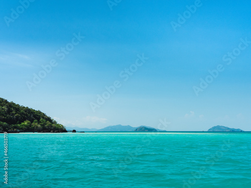 Scenic view of peaceful white sand bar and crystal clear turquoise water against clear blue sky. Koh Kham Island, Near Koh Mak Island, Trat, Thailand.