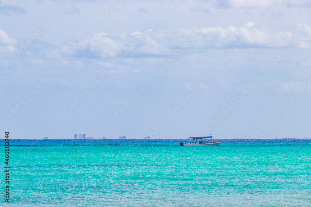 Obraz premium Boats yachts between Cozumel island and Playa del Carmen Mexico.