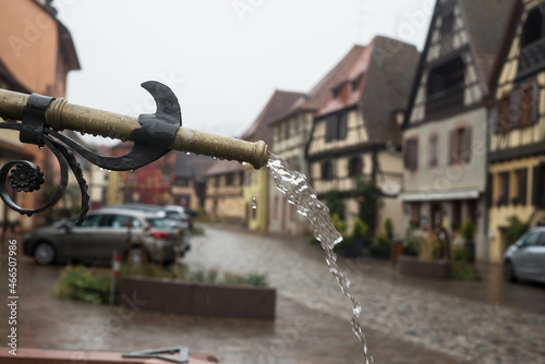 Closeup of retro fountain in the famous village of Bergheim in France