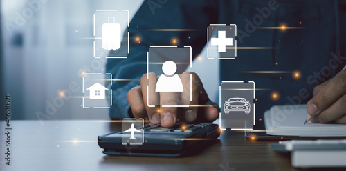 Close up man calculate expense monthly with banking life insurance home loan travelling credit card annual savings money heath care costs growth up chart. Financial and spending payment concept.