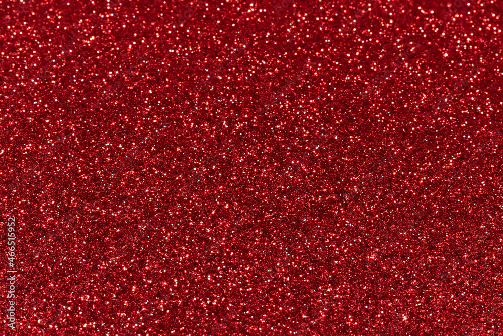 Red sparkling glitter background, christmas abstract shiny texture. Holiday lights