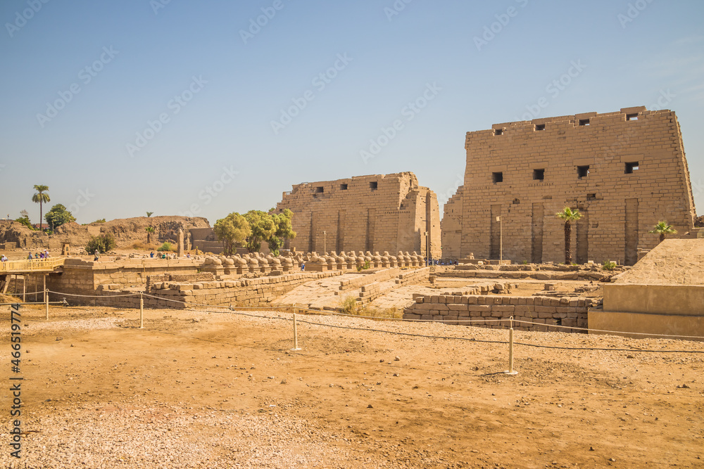 Anscient Temple of Karnak in Luxor - Ruined Thebes Egypt. Walls and Sphinxes at Karnak Temple. Temple of Amon-Ra. Main entrance Anscient Temple of Karnak in Luxor - Ruined Thebes Egypt. Walls and Sphinxes at Karnak Temple. Temple of Amon-Ra. Main entrance