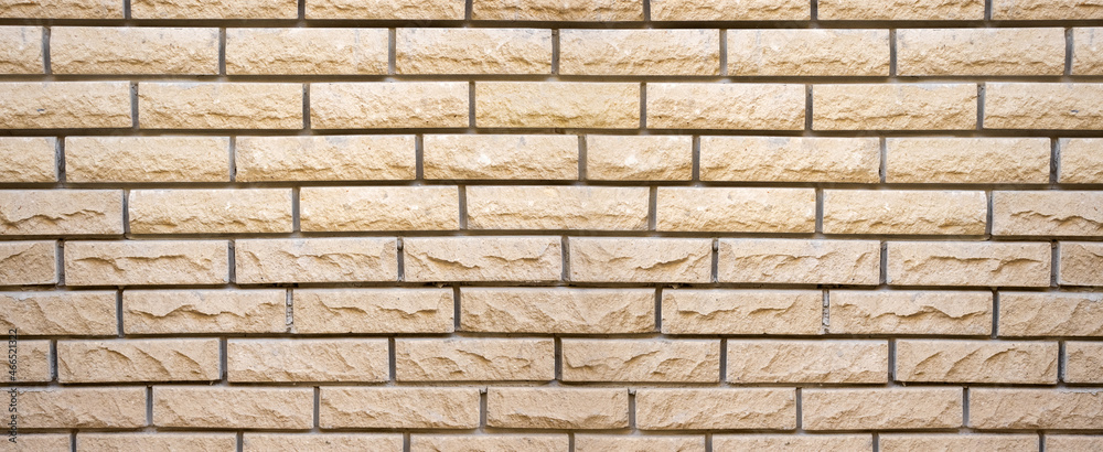 the image of a brick wall as a background close-up the image of a brick wall as a background close-up