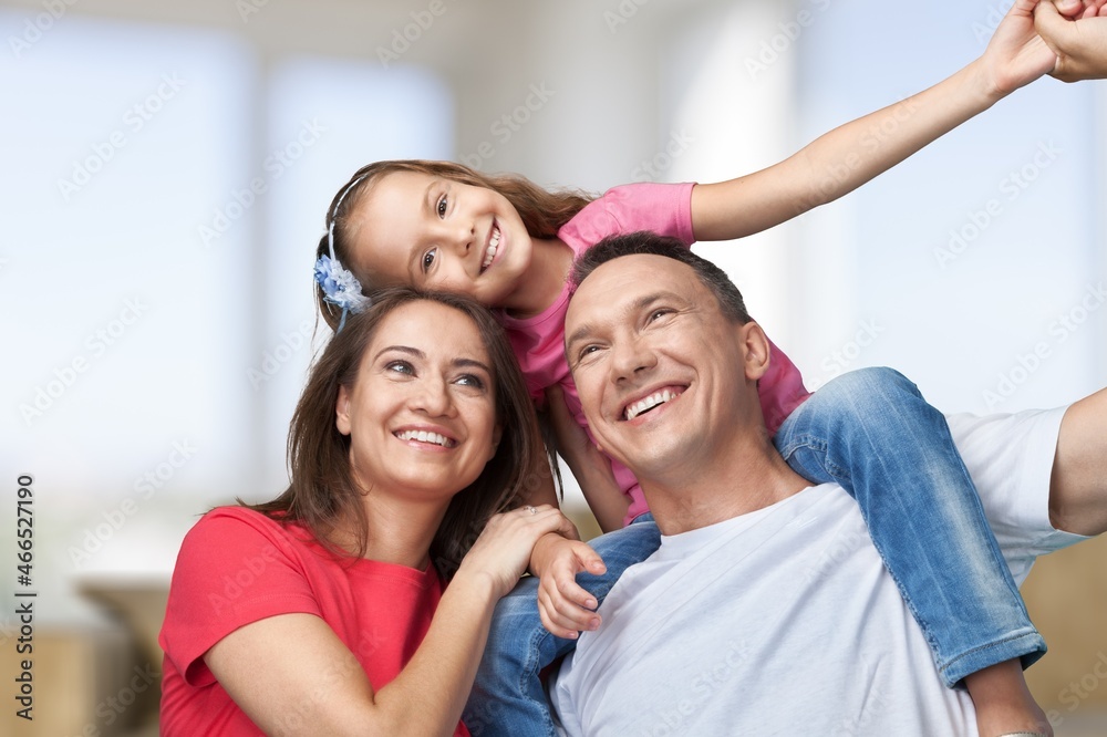 Cheerful happy young Family having Fun Together At Home Cheerful happy young Family having Fun Together At Home