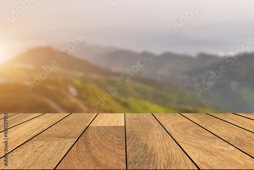 Empty old wooden table in front of blurred beautiful view on top of the mountain and sunrise background. Can be used for display or montage for show your products..