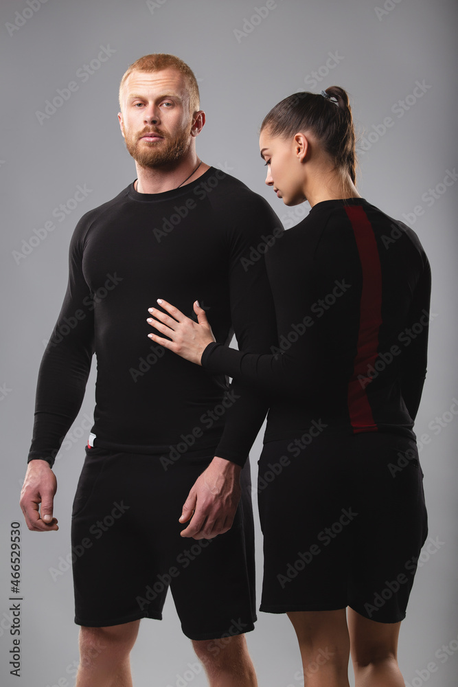Studio portrait of a young couple in sportswear. Healthy lifestyle Studio portrait of a young couple in sportswear. Healthy lifestyle