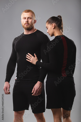 Studio portrait of a young couple in sportswear. Healthy lifestyle