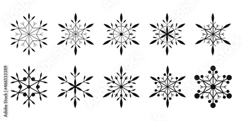 Vector set of snowflakes in linear style.   ollection of black snowflakes on white background